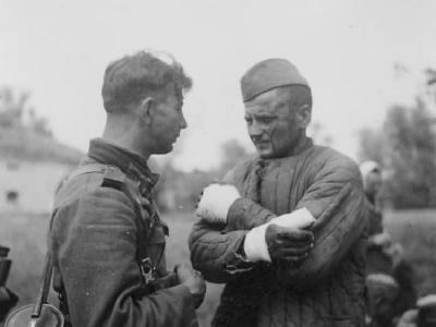 Wehrmacht Landser and wounded POW