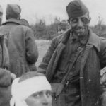 Group captured battered Russian POWs in trenchline