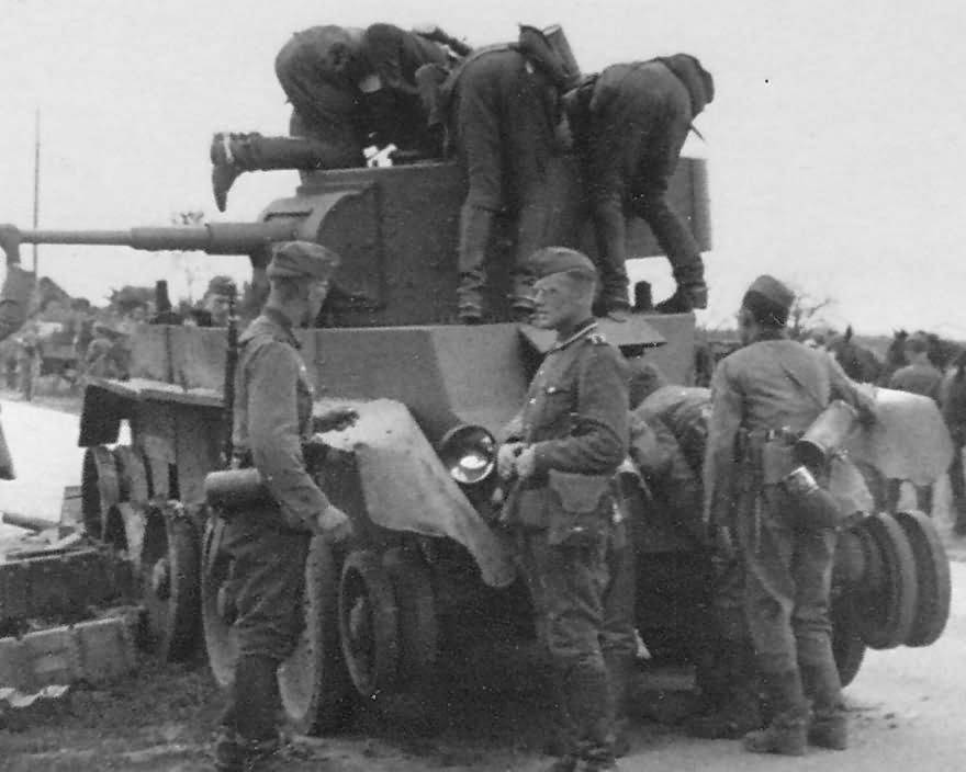 Soviet tank BT-7 and wehrmacht soldiers