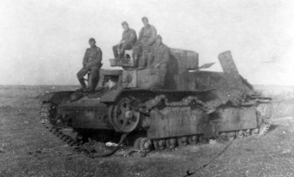 German troops pose next to a captured and destroyed T-28